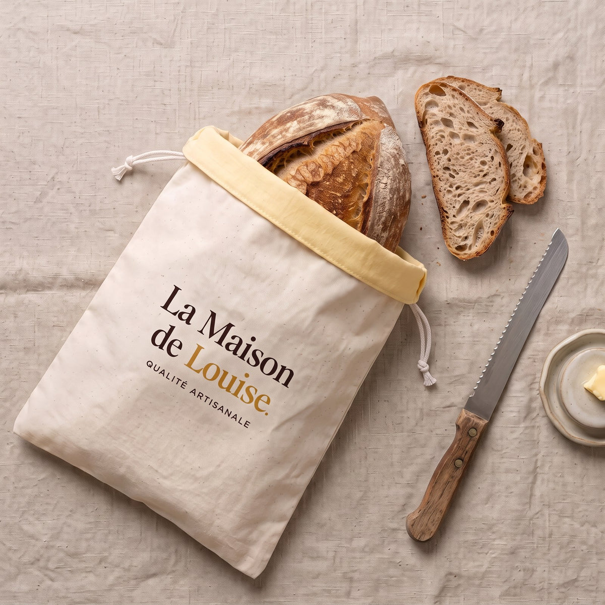 The Louise Bag with sliced sourdough on linen